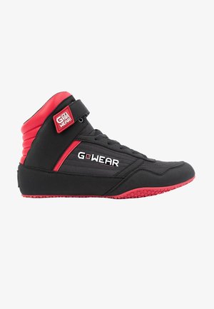 High-top athletic shoe in black and red; features a fabric upper, padded ankle, Velcro strap, textured sole, and logo detail.