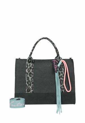 Black tote bag with leopard print handles, teal and pink tassel charm, and separate teal shoulder strap with pink script.