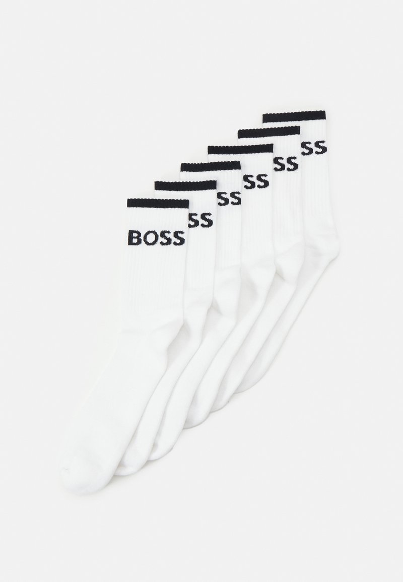 White crew socks, featuring a black ribbed cuff and the word "BOSS" in black, sold in a set of six. Smooth texture, ankle length.