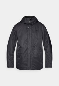Veste noire imperméable à capuche avec fermeture éclair frontale et fermeture par pression, poches latérales zippées et sangles réglables aux poignets.
