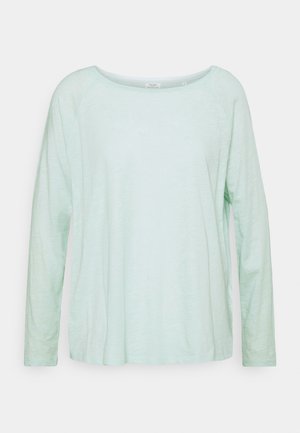 Light mint green long-sleeve shirt with a relaxed fit, round neckline, and raglan sleeves, made from a soft, textured fabric.