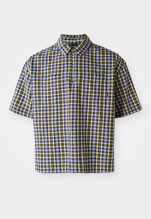 Camicia a maniche corte a quadri nei colori blu, giallo e nero. Presenta un colletto, una tasca e una vestibilità casual. Il tessuto appare leggero e texturizzato.