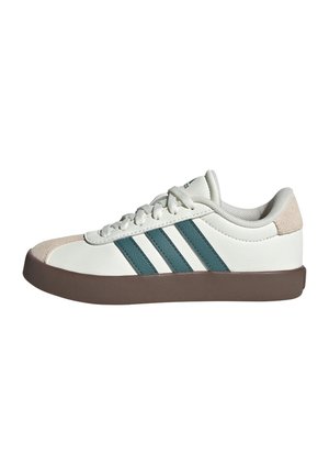 White sneaker with teal three-stripe design, suede accents, and a brown rubber sole. Features a rounded toe and lace-up closure.