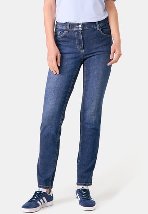 Dunkelblaue Slim-Fit-Jeans aus Denim mit einem Vorderknopf- und Reißverschluss, fünf Taschen und kontrastierenden Nähten.