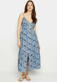 Abito maxi floreale blu con scollatura a V, spalline sottili e dettagli di bottoni sul davanti; presenta uno spacco e un fondo a balze.