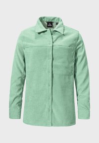 Mint green corduroy shirt with a button closure, long sleeves, and a chest pocket. Features vertical ribbed texture and a relaxed fit.
