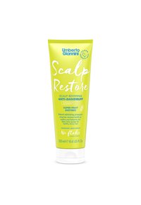 Groene tube van Umberto Giannini Scalp Restore shampoo, 250 ml. Kenmerkt zich door witte tekst met de productnaam, details en een cruelty-free symbool.