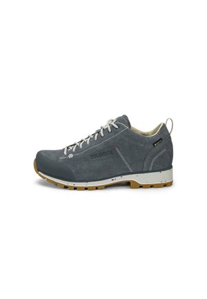 Gray suede hiking shoe with white laces, rubber toe cap, speckled white midsole, and brown treaded outsole, labeled Dolomite and Gore-Tex.