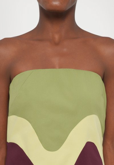 Strapless, color-blocked dress featuring olive green, pale yellow, and burgundy waves. Smooth fabric with clean edges and simple design.