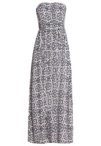 Axelös maxiklänning med ett svart-vitt geometriskt mönster och ett tygskärp i midjan med resår.