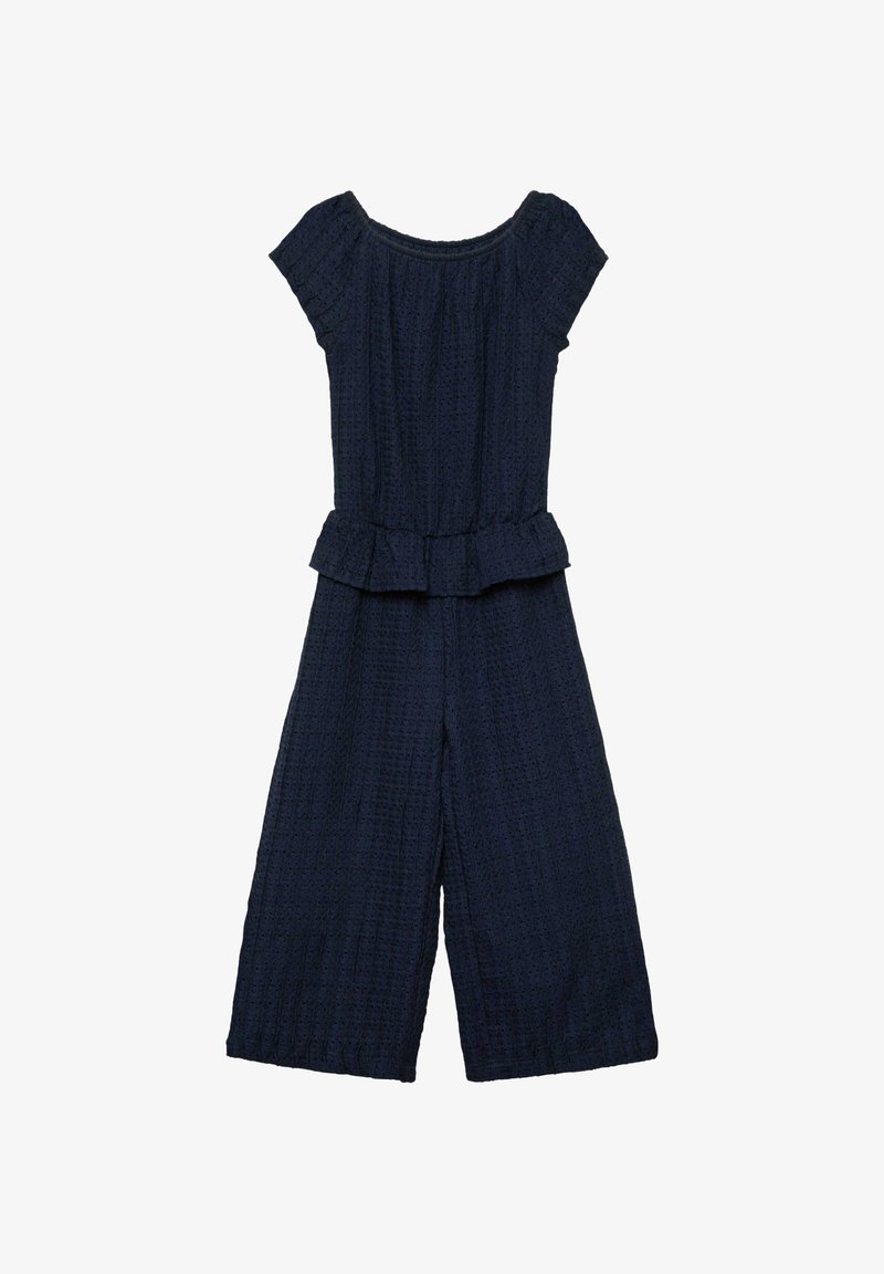 Combinaison en tissu bleu marine texturé avec manches courtes, encolure ronde, taille peplum et pantalon large raccourci.