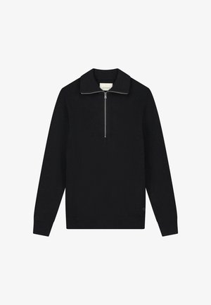 Must ülehõlma tõmblukuga must ribakudum. Omab pikki varrukasid ja sirget äärt. Tekstuuriga kangas minimaalsete detailidega.