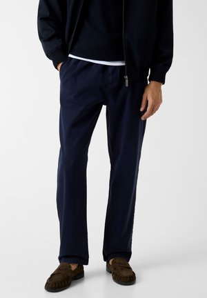 - Spodnie treningowe