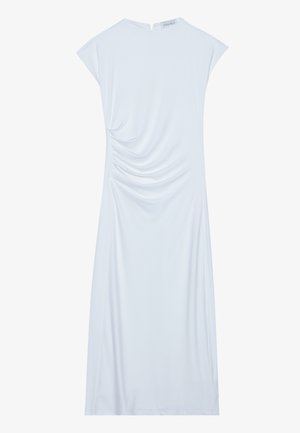 White knee-length dress made of soft fabric, featuring cap sleeves and gathered detailing on one side, with a rounded neckline at the back.