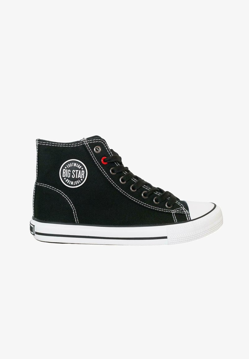 Black canvas high-top sneaker with white rubber toe cap, contrasting white stitching, red accent eyelet, and "Big Star" logo patch on the side.