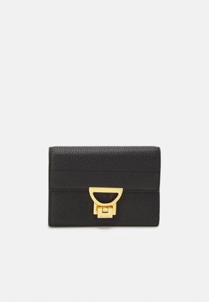 Black leather wallet with textured finish, gold-tone hardware, and a distinctive geometric clasp. Compact and rectangular design.