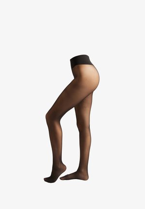 Collants noirs transparents avec une texture lisse, une large taille noire unie, et une coupe ajustée jusqu'à la cheville.