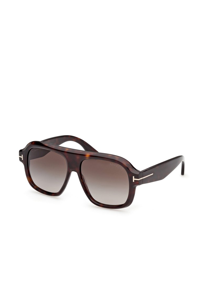 Ochelari de soare cu cadrul pătrat, din material țestoasă, cu lentile gradient și accente metalice pe brațe. Material din plastic neted și design curbat.