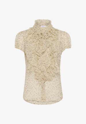 Béžová blúzka s viacvrstvovými volánmi a vysokým golierom, zdobená malými čiernymi bodkami po celej ploche. Krátke rukávy a zapínanie na gombíky vpredu.
