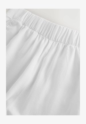 Białe spodnie z tkaniny z elastycznym pasem, marszczonym przeszyciem i miękką, lekką fakturą.