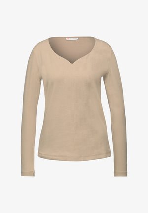 Beige long-sleeve top with a ribbed texture, featuring a deep V-neck and fitted silhouette, crafted from soft, stretchable fabric.