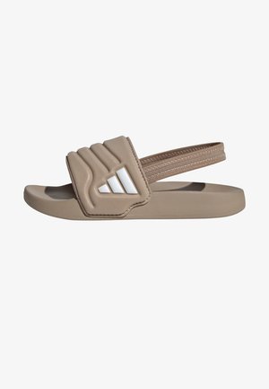 Sandale beige à enfiler avec bride supérieure rembourrée, logo Adidas blanc et bride de talon élastiquée pour un maintien sûr.