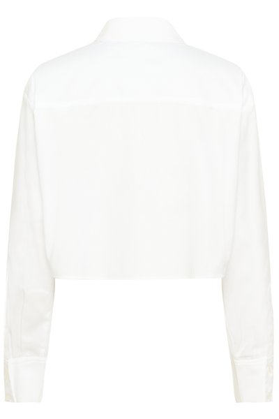 Chemise blanche coupée, fabriquée en tissu lisse. Dotée d'un col pointu et de manches longues avec poignets à boutons. Design simple, sans motifs visibles.