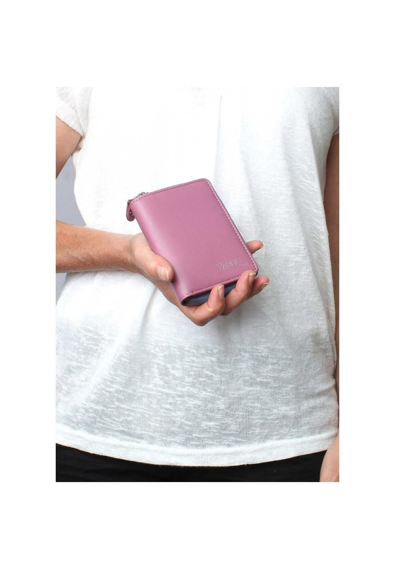 Compact pink leather wallet with a smooth texture, featuring a zipper closure and a subtle logo embossed on the front.
