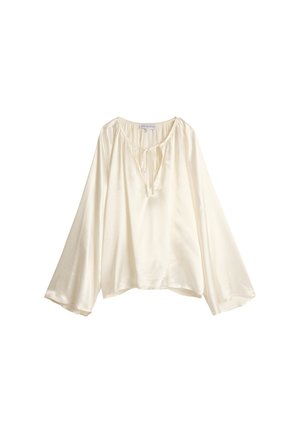 Kremfarget bluse med avslappet passform, vide ermer og detaljer med knytning i halsen. Laget av lett, glatt stoff med en subtil glans.