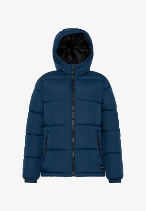 Mørkeblå puffjakke med aftagelig hætte, frontlynlås og to sidelommer. Har kviltede paneler og elastiske manchetter.