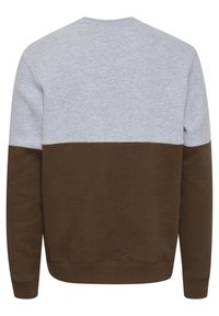 Gray and brown color-blocked sweatshirt with a round neck, long sleeves, and soft texture. Features a smooth transition between colors.