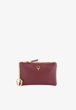 Burgundy leather pouch with gold hardware, zip closure, and a chain strap. Features a square logo accent and textured surface.