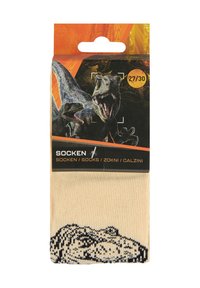 Calcetines en beige con un patrón de dinosaurios negros en la zona de los dedos. Empaquetados con una etiqueta colorida que presenta gráficos de dinosaurios e indicación de tamaño.