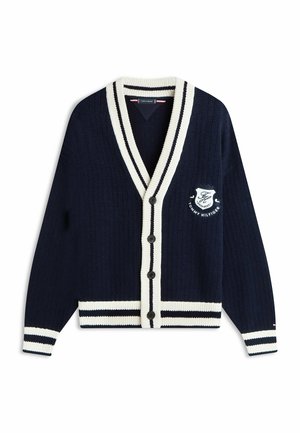 Cárdigan azul marino abotonado con ribete de rayas blancas en el cuello, los puños y el dobladillo, con el logotipo bordado de Tommy Hilfiger en el pecho izquierdo.