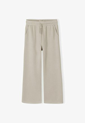 Pantaloni bej cu croială largă, talie elastică, șnur și buzunare laterale, confecționați dintr-un material moale și confortabil.