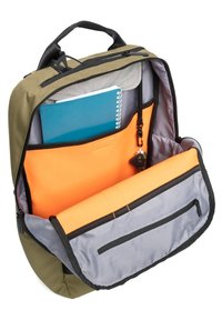 Green fabric backpack with a gray lining, featuring an inner compartment with orange padding, a blue notebook, and a zippered pocket.