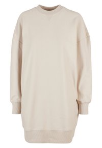 Sweatshirt beige oversize avec une texture côtelée, col rond, épaules tombantes et manches longues. Présente un ourlet incurvé et des coutures minimales.