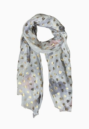 Sciarpa grigio chiaro con motivi a cuore in oro metallizzato e nero, annodata con un giro largo e bordi sfrangiati.