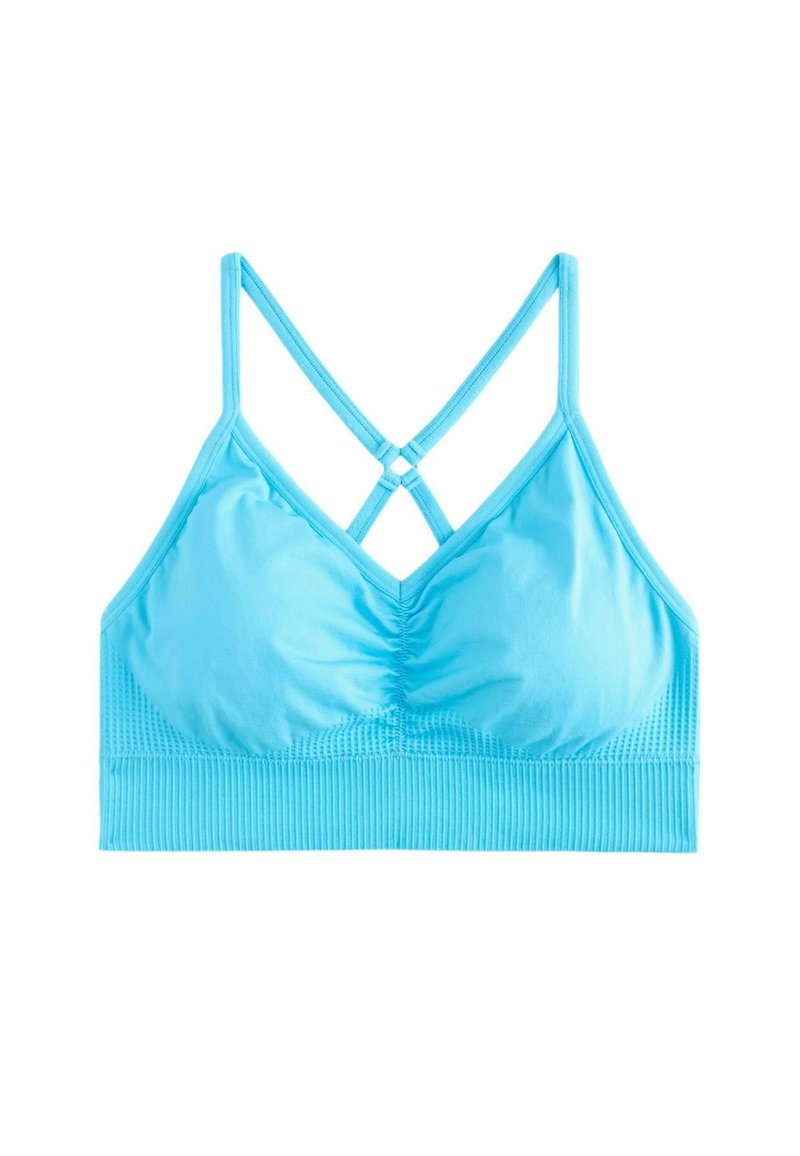 Lichtblauwe bralette met een geplooid voorpand, geribbelde textuur aan de onderkant en kruislingse bandjes op de rug. Glad en rekbaar materiaal.