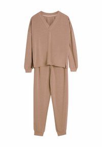 Brązowa, długosleeve top o dekolcie w kształcie V w luźnym kroju z bokami rozciętymi, dopasowana do spodni dresowych z tapered o elastycznych mankietach.