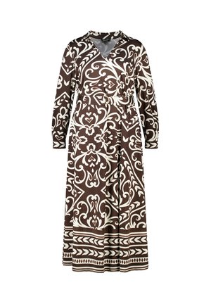 Robe portefeuille marron avec des motifs blancs ornés, manches longues, taille ceinturée et design fluide. Le matériau semble lisse et léger.