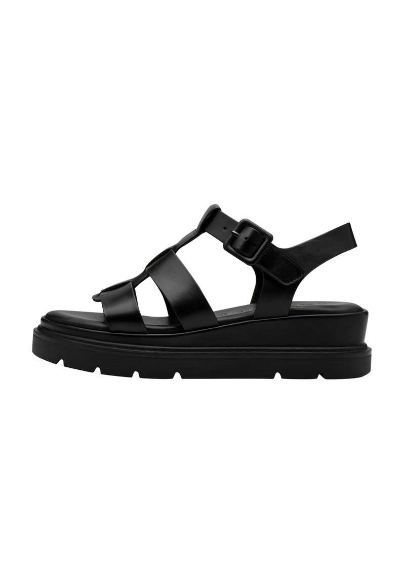 Schwarze Plateausandalen mit breiten, glatten Riemen und verstellbarem Schnallenverschluss. Texturiertes Fußbett mit Rillen für besseren Halt. Modernes, minimalistisches Design.
