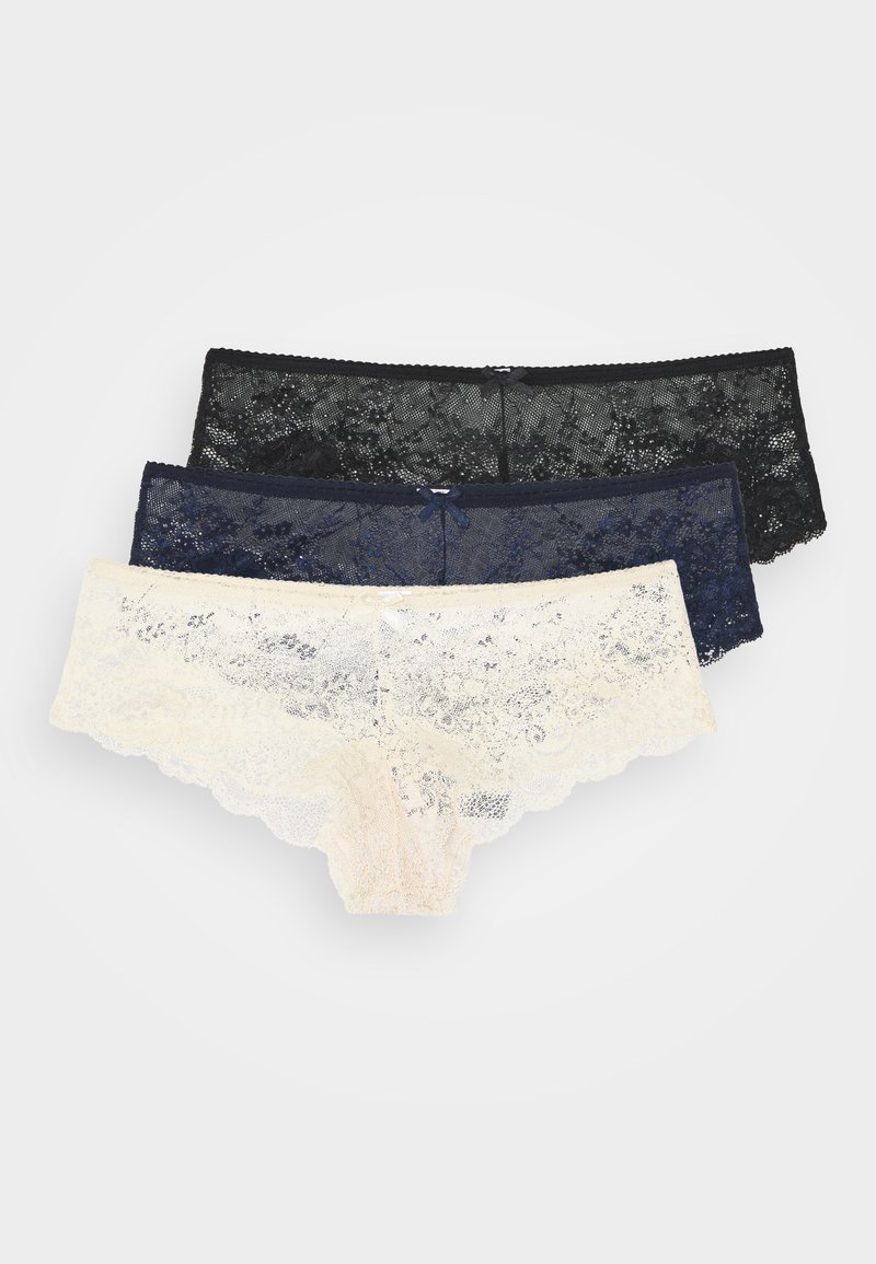 Set van drie kanten slips: zwart, donkerblauw en crème. Met geschulpte randen, delicate bloemenpatronen en kleine strikjes bij de taille.
