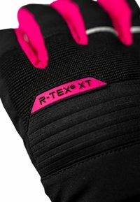 Black gloves featuring bright pink accents and ridged fabric. A label reading "R-TEX XT" is visible on the wrist area. Soft, textured material.