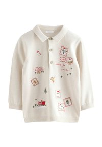 Lichtcrème sweater met een kraag, voorzien van speelse borduursels en gestikte accenten in het rood en groen met een feestelijk thema.