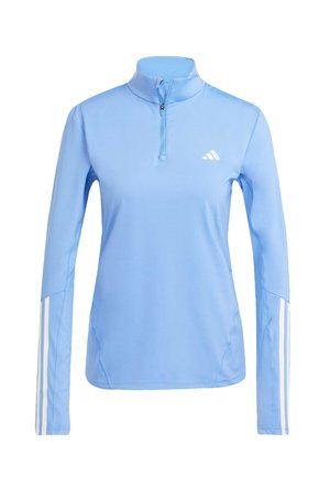 Light blue long-sleeve top with a quarter-zip collar, featuring white Adidas logo and three white stripes along the sleeves. Smooth fabric texture.