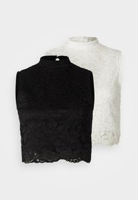 Dos blusas sin mangas de cuello alto en encaje negro y blanco, que presentan bordes de dobladillo en forma de concha y patrones florales con un acabado texturizado.