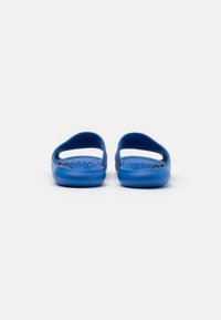 Blue rubber sandals with an open back and side cutouts. Textured footbed and smooth sole. Simple design suitable for casual wear.
