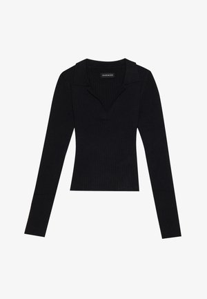 Haut noir à manches longues côtelé avec un col, fabriqué en tissu extensible, présentant une silhouette ajustée et une texture subtile.