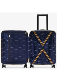 Valigia rigida blu navy con un design strutturato, dettagli in zip dorati e un interno spazioso con scomparti organizzati e cinghie.